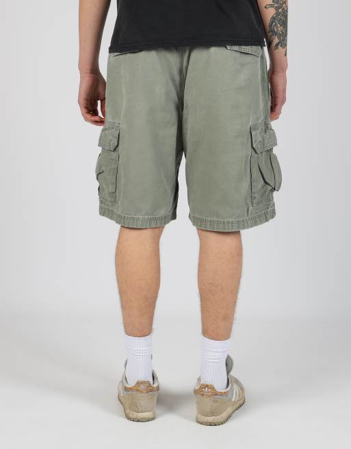 Vintage Carhartt 34x21 canvas cargo shorts in dark green