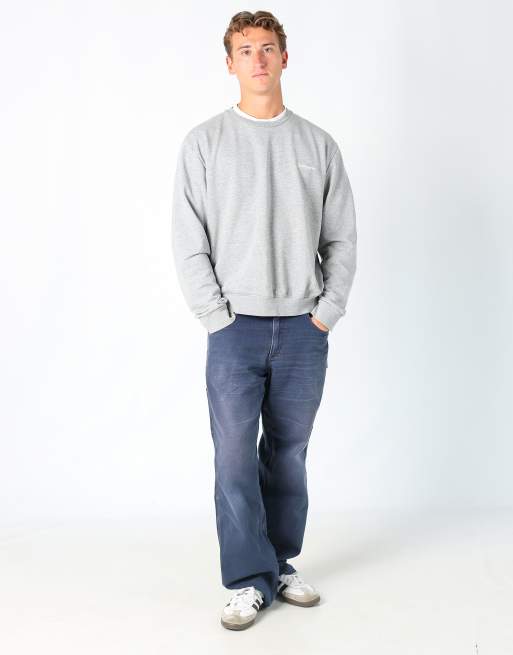 Vintage Carhartt 34x30 canvas carpenter jeans in navy blue