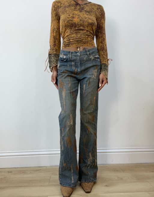 Vintage flared jeans with metallic print in blue
