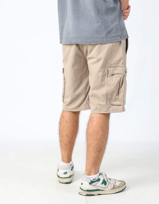 Vintage Levi's 33x22 canvas cargo shorts in tan