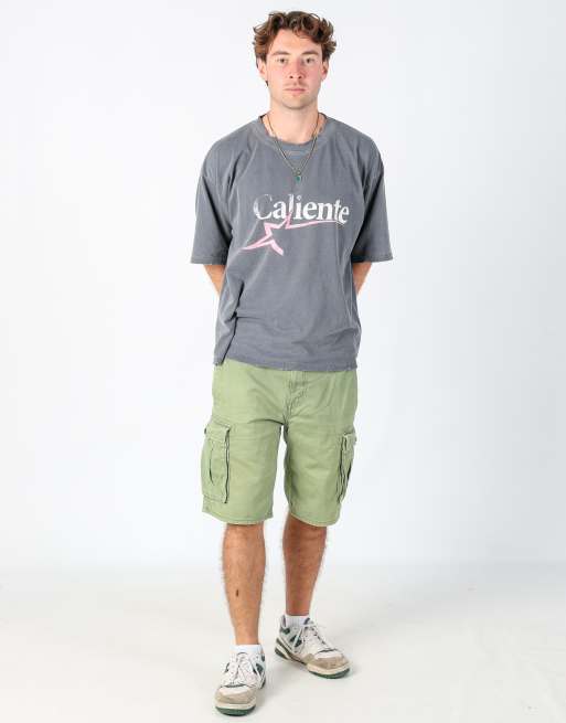 Vintage Levi's 34x22 canvas cargo shorts in light green