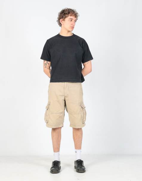 Vintage Levi's 34x22 canvas cargo shorts in tan - view 1