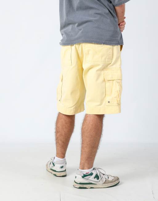 Vintage Levi's 34x23 canvas cargo shorts in yellow