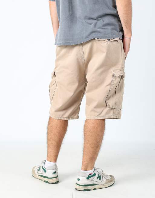 Vintage Levi's 36x23 canvas cargo shorts in tan