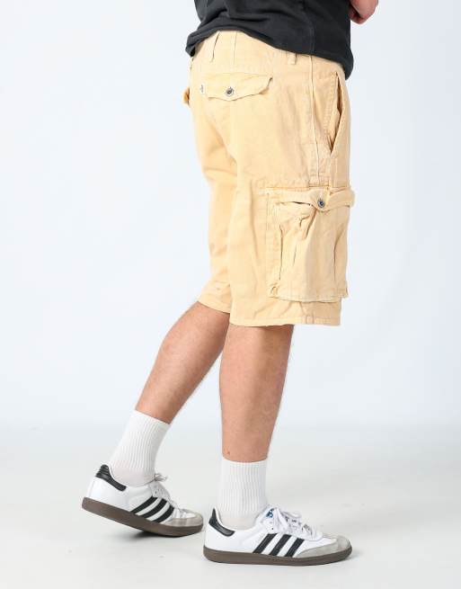 Vintage Levi's 36x34 canvas cargo shorts in yellow