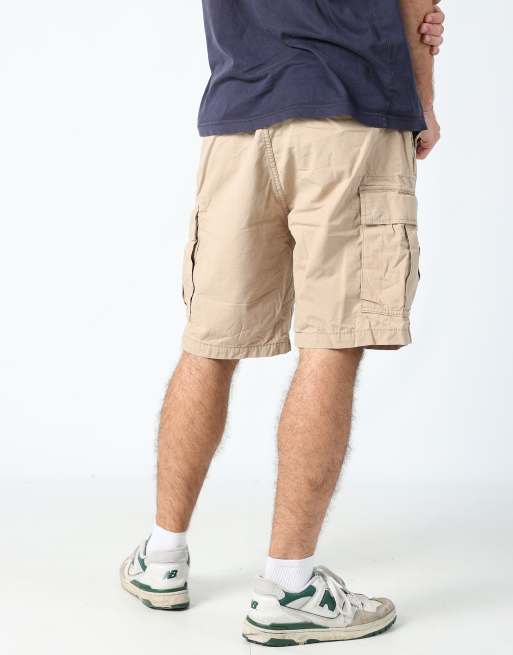 Vintage Levi's 36x76 canvas cargo shorts in tan