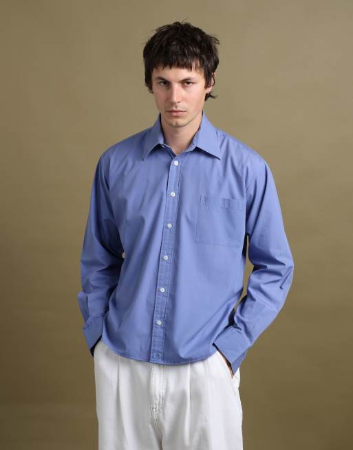 Vintage size L Yves Saint Laurent shirt in mid blue, 1 of 5