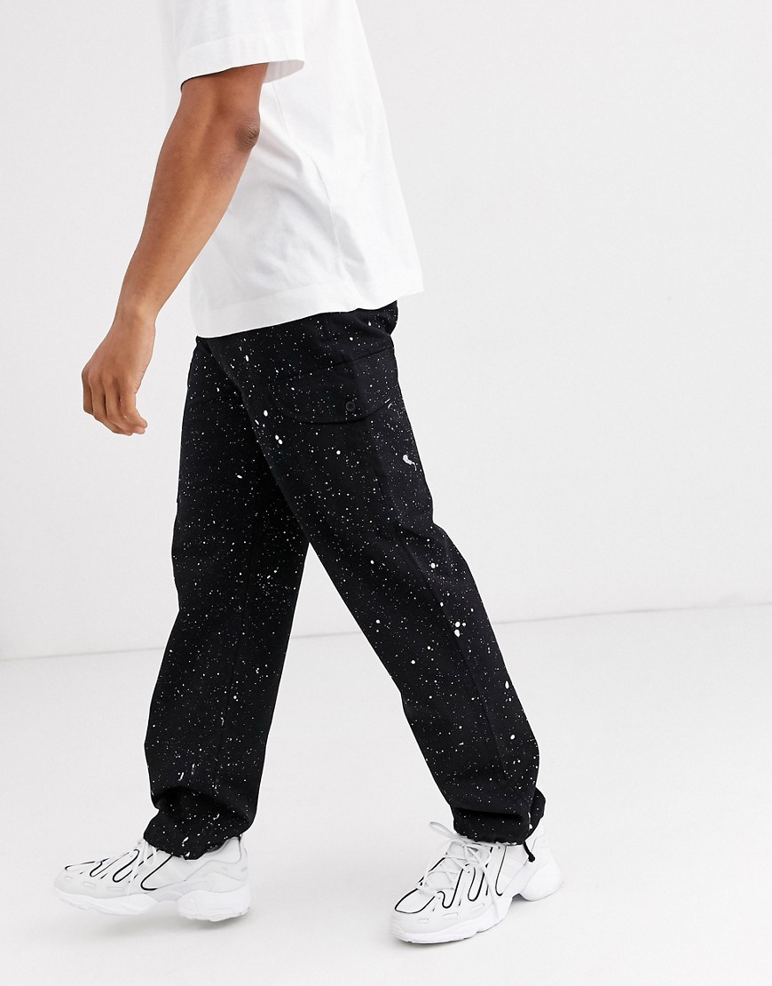 Vintage Supply paint splattered cargo trousers in black