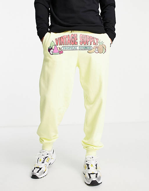 Vintage Supply tropical summer print joggers in yellow