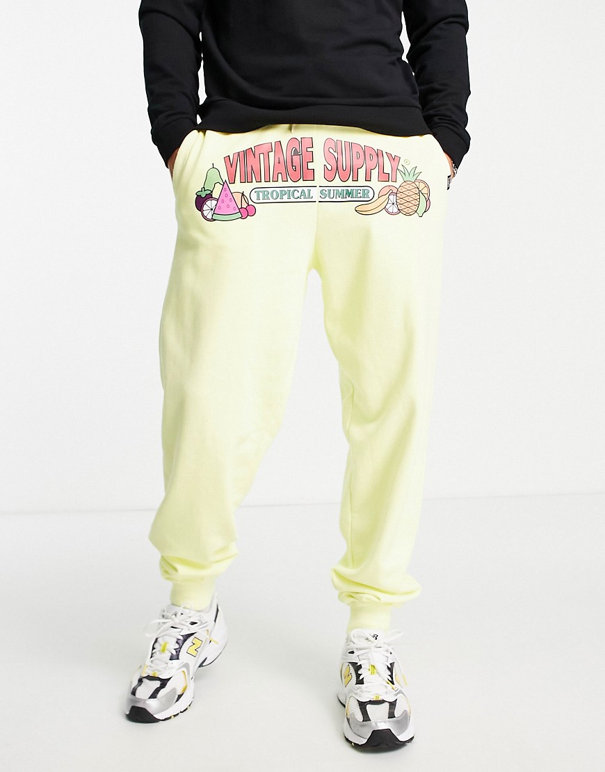 Vintage Supply tropical summer print sweatpants in yellow