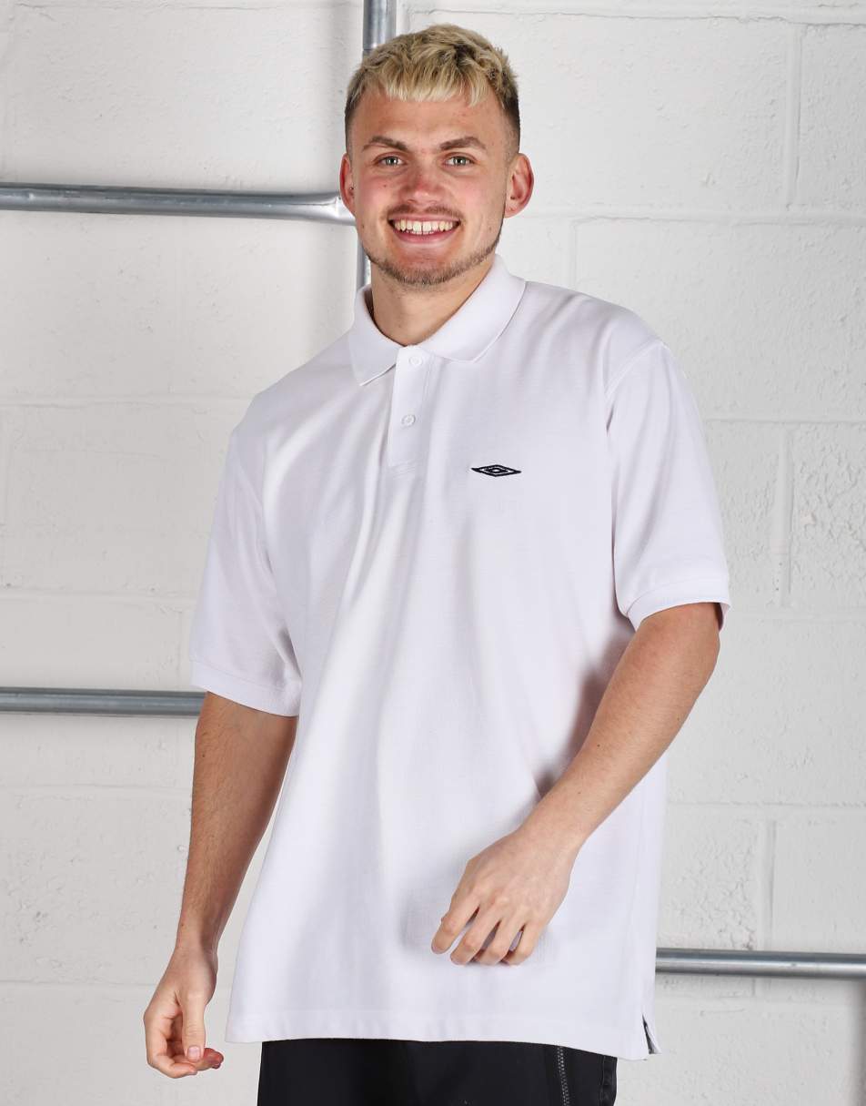 Vintage Umbro Size XL logo short sleeve polo shirt in white