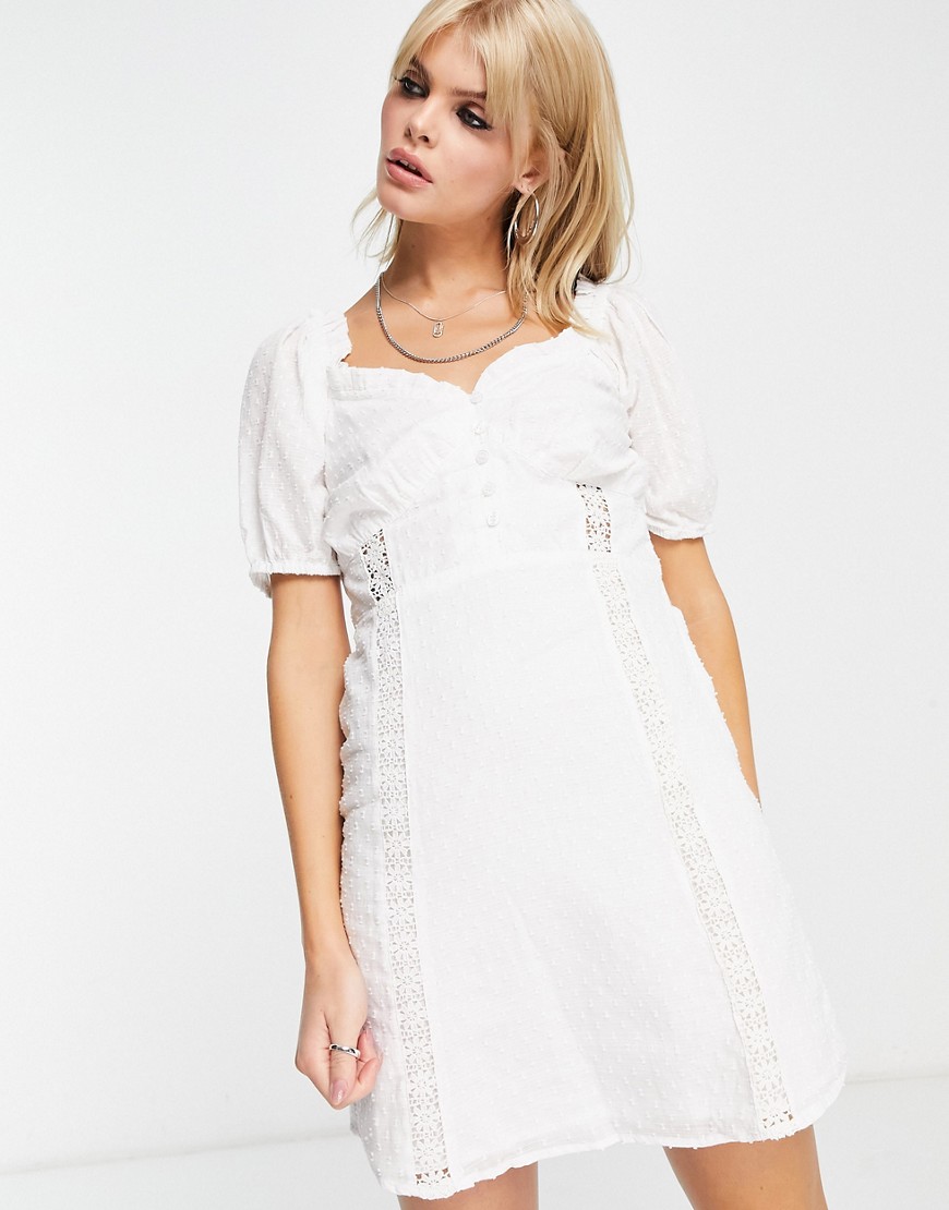 textured mini dress with crochet detail in white