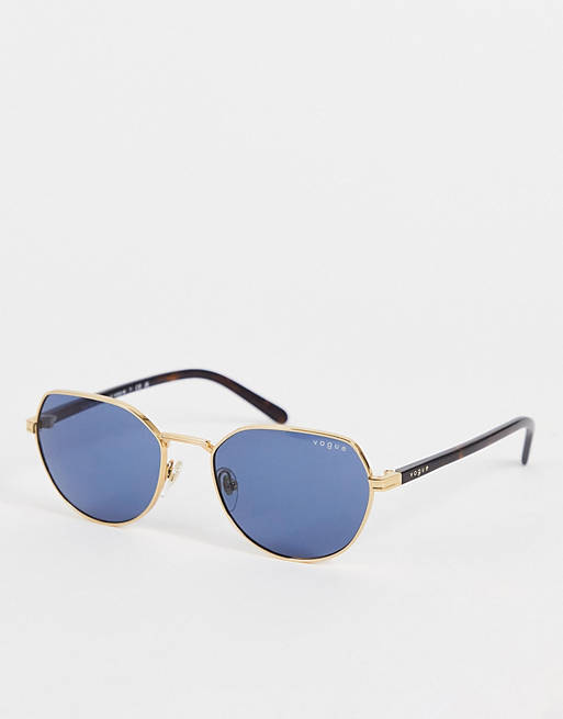 Vogue X Hailey Bieber - Guldfarvede runde solbriller i metal med blå glas 