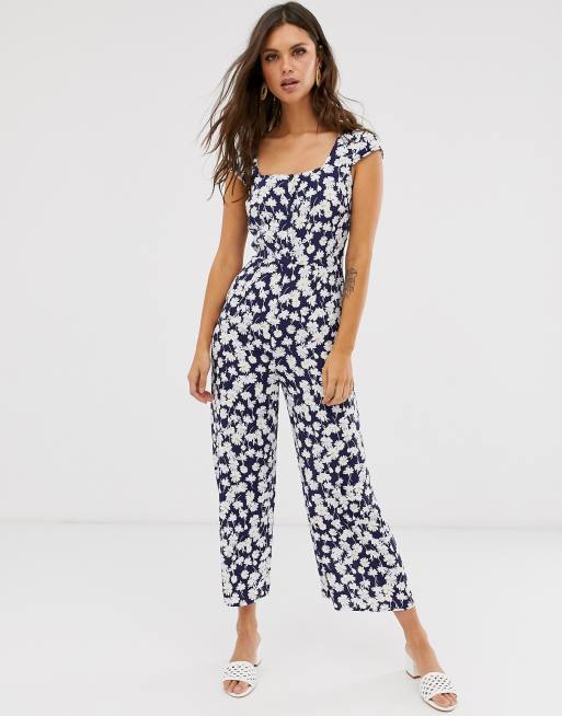Warehouse - Jumpsuit met kapmouwen en madeliefprint in marineblauw