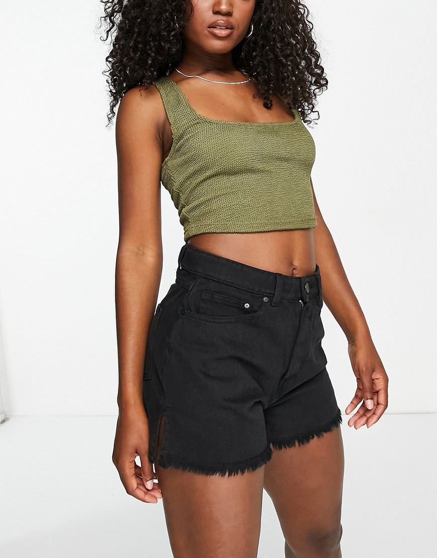 Waven high rise distressed denim shorts with side slit in black
