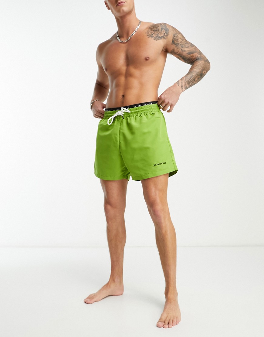 We Are We Wear bobbie standard length swim short with logo waist band in green