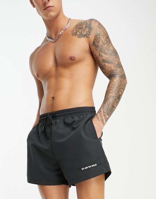 We Are We Wear Bobbie standard length swim shorts in black