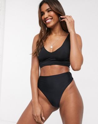 We Are We Wear – Mix & Match – Schwarzes Bikiniunterteil im Tanga-Stil aus recycelten Materialien mit hohem Beinausschnitt und hohem Bund