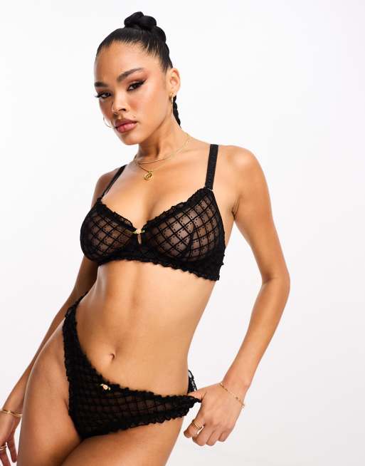 We Are We Wear – Ungefüttertes Bustier aus beflocktem Netzstoff in Schwarz mit Rüschensaum