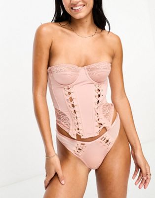 We Are We Wear vintage style thong with lace up detail in pale pink - ASOS Price Checker