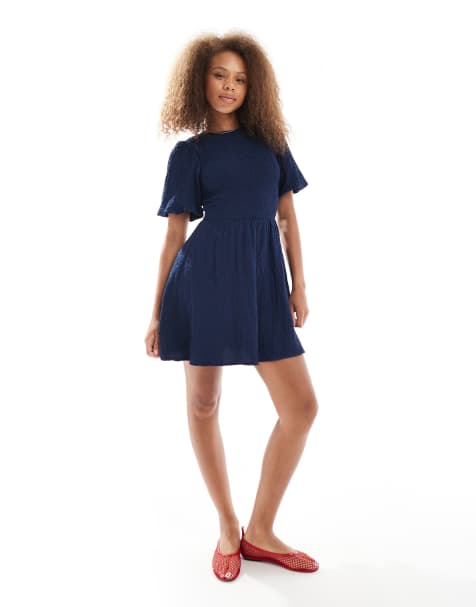 Wednesday's Girl – Blå miniklänning med smockad byst och puffärmar - view 1
