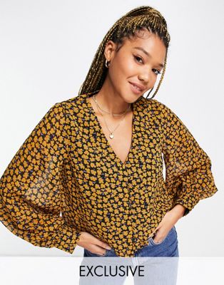 Chemises et blouses Wednesday's Girl - Blouse rétro à manches ballon longues et imprimé bouton d'or