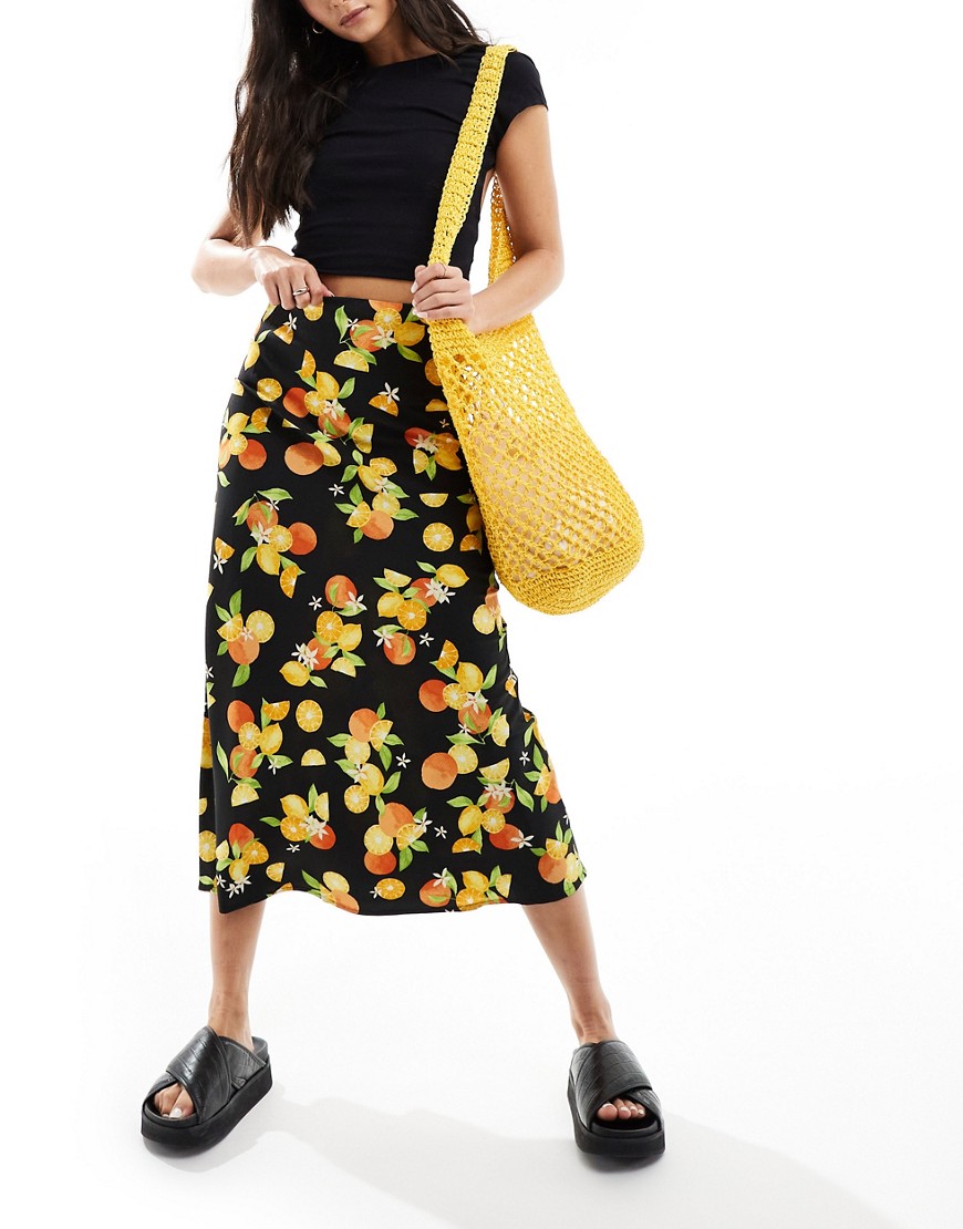 Wednesday’s Girl citrus fruit print bias cut midaxi skirt in black