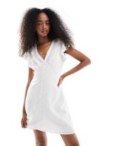 Wednesday's Girl smudge spot ruffle wrap mini dress in pale pink