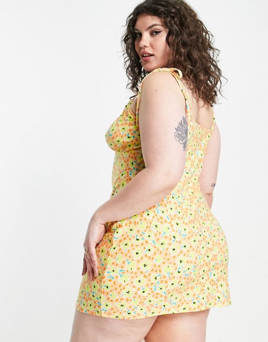 https://images.asos-media.com/products/wednesdays-girl-curve-tie-strap-ruched-bust-cami-dress-in-peach-spring-floral/202510811-2?$n_550w$&wid=550&fit=constrain