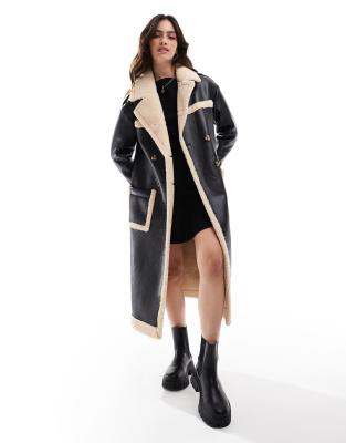 faux shearling oversized aviator longline coat in black and cream