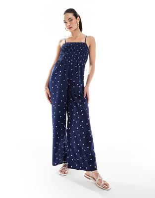 Wednesday's Girl - Gesmokter Jumpsuit in Marineblau mit Polka-Dots in Creme