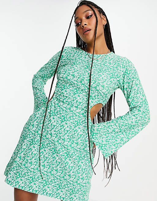 Women Wednesday's Girl long sleeve mini dress with cut outs in green ditsy 