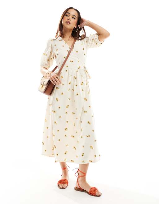Wednesday's Girl - Nette midi-jurk met zonnebloemprint en pofmouwen in crème