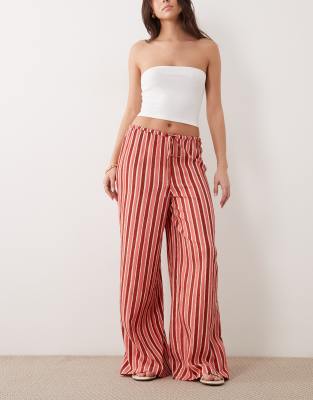 Pantalon ample à rayures et détail noué - Rose L