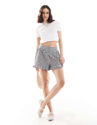 Wednesday's Girl ruffle edge gingham shorts in black - view 1