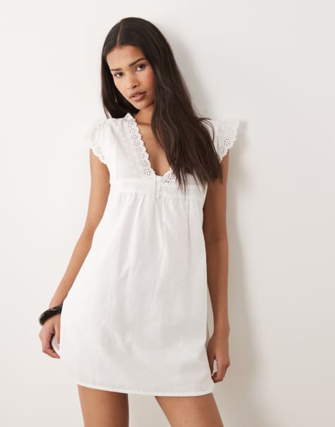 Wednesdays Girl ruffle sleeve lace edged smocked mini dress in white