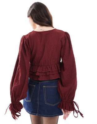 Wednesday's Girl textured tie-sleeve blouse in deep red