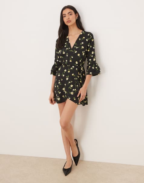 Wednesday's Girl wrap around long sleeve mini dress in yellow floral - view 1
