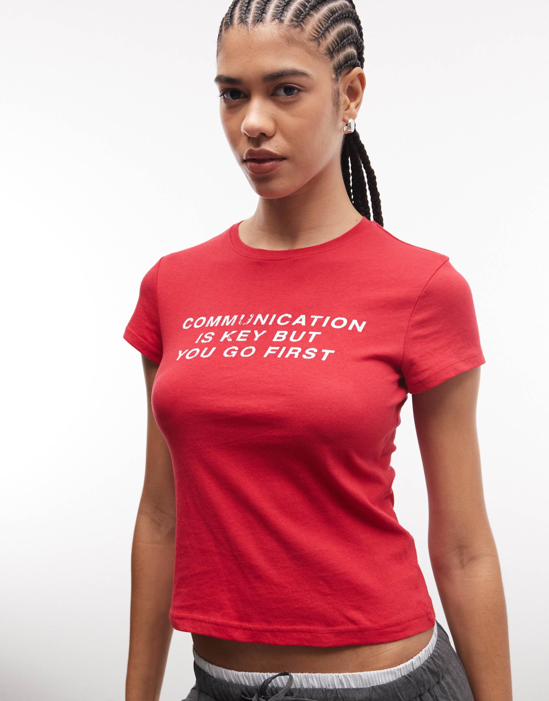 weekday 90s baby tee with slogan graphic in red