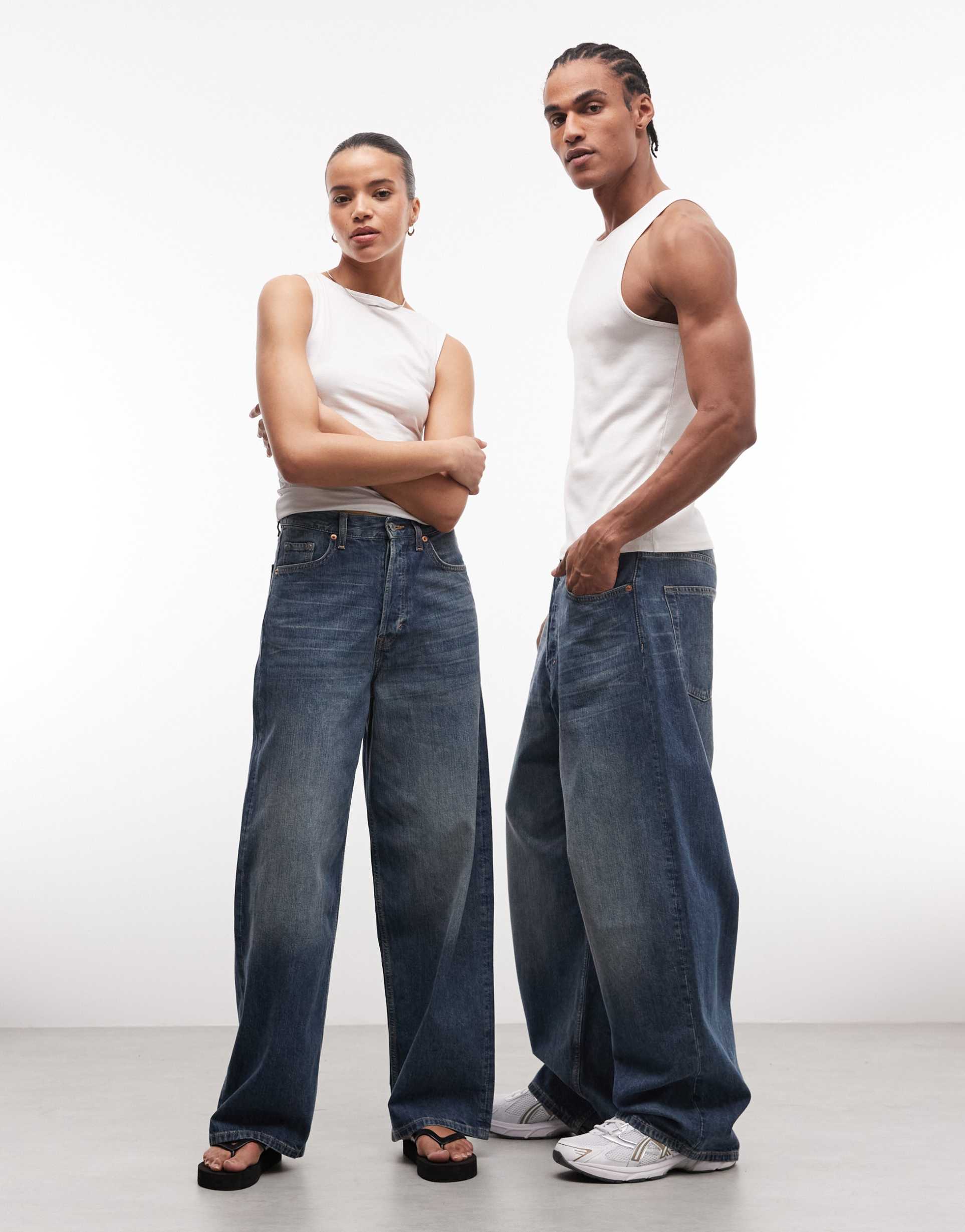 weekday astro unisex low rise baggy fit jeans in faded blue wash