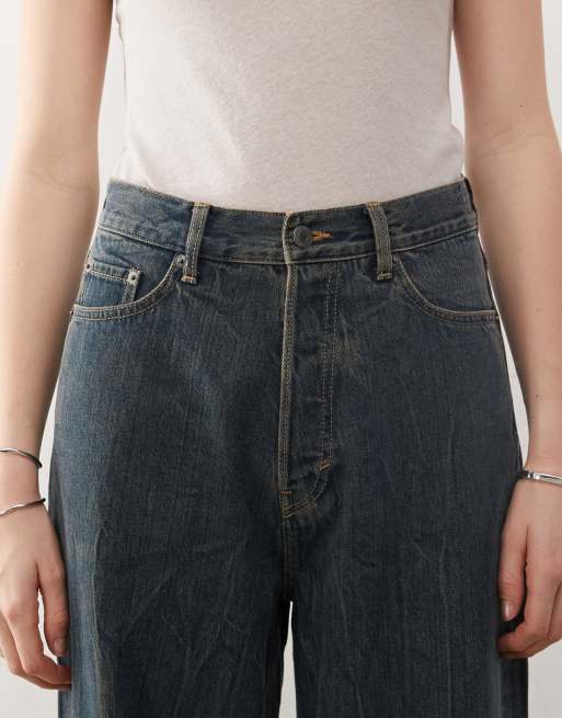 Weekday Astro Unisex low rise loose fit baggy jeans in streaky mid blue wash