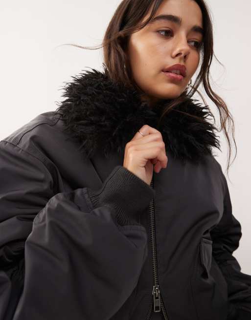 Weekday bomber jacket with faux fur collar in off-black