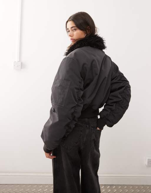 Weekday bomber jacket with faux fur collar in off-black