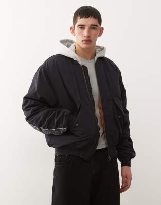 Weekday Bomber Jacket With Jersey Hood And Contrast Camo Graphic Sleeves In Blue