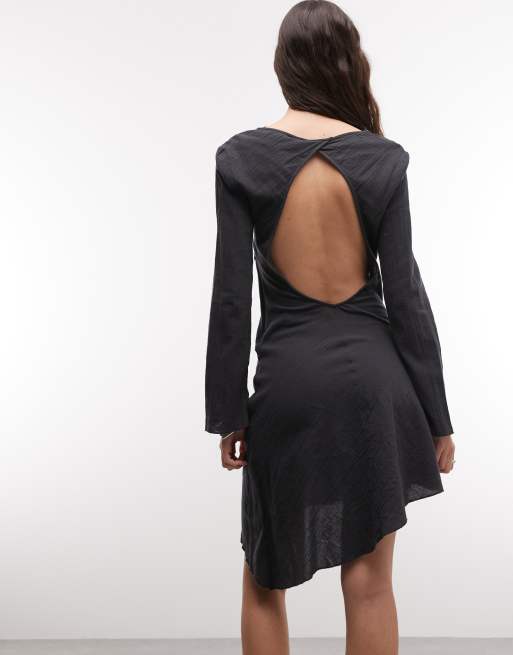 long sleeve asymmetric hem mini dress in black Weekday crinkle long sleeve mini dress with open back and asymmetric hem in  off-black