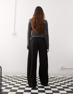 Weekday Dara low waist wide leg trousers with front pleats in black