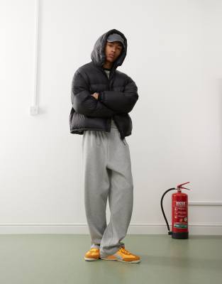 Weekday down hooded puffer coat with zip pockets in black