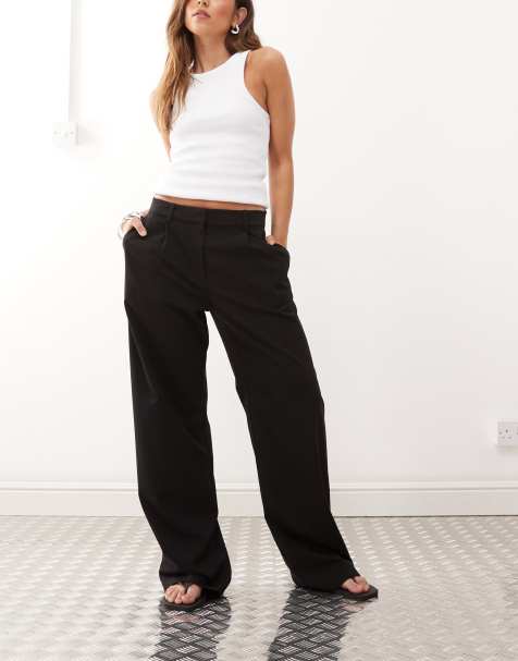 Weekday – Drew – Svarta, slouchy byxor med veck framtill och medelhög midja - view 1