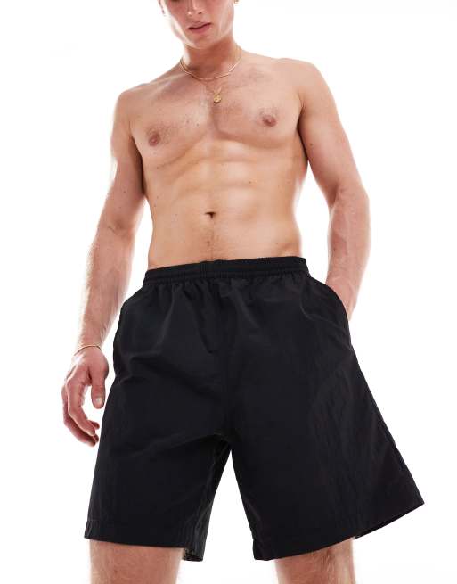Weekday Ed skater style swim shorts in black | ASOS