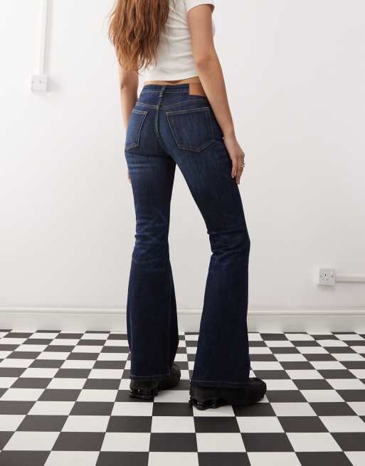 Weekday Flame low waist flared jeans in dark blue wash ASOS